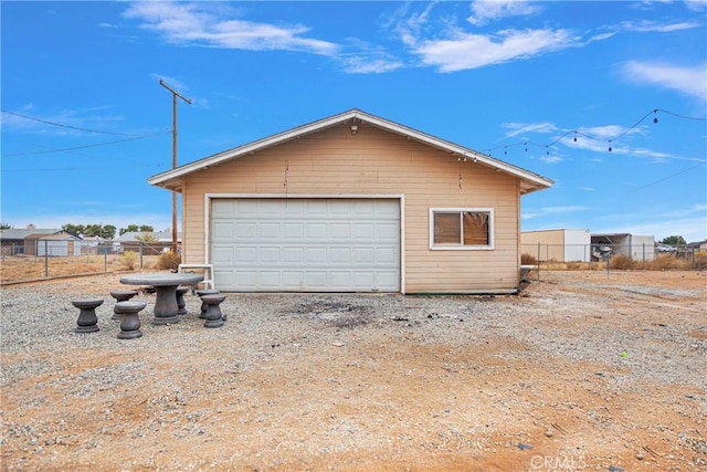 detached garage with fence