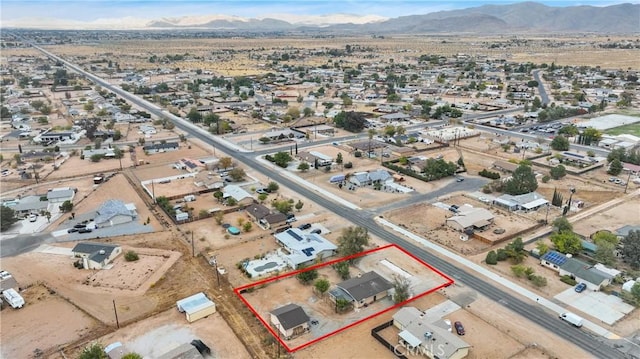 drone / aerial view with a desert view and a mountain view