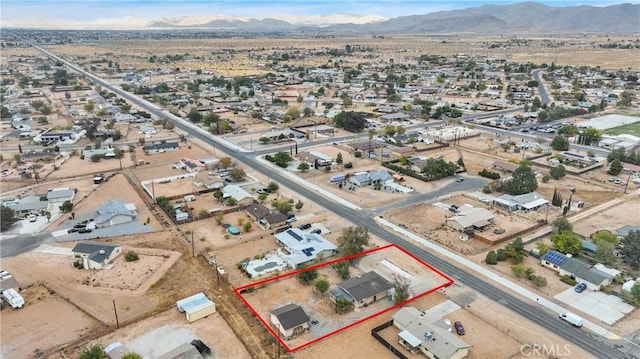 birds eye view of property featuring a mountain view