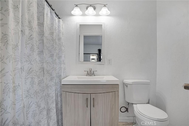 full bathroom with vanity and toilet