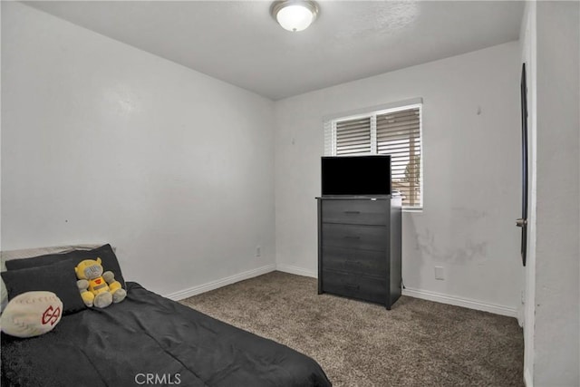 unfurnished bedroom with carpet floors and baseboards