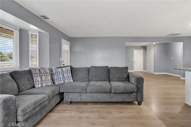 10590 Navajo Rd, Apple Valley, CA 92308 - living room with light wood finished floors and baseboards