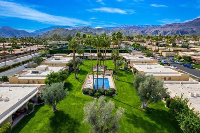 birds eye view of property featuring a mountain view