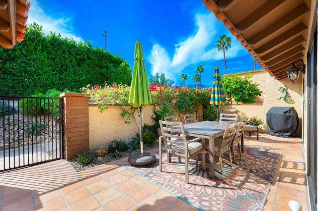 view of patio featuring a grill