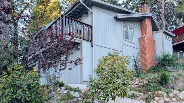 view of home's exterior with a balcony