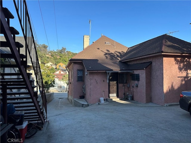 rear view of property featuring a patio