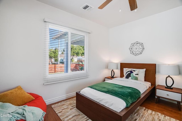 bedroom featuring ceiling fan and light hardwood / wood-style floors