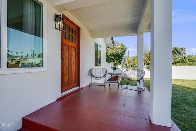 property entrance featuring a porch