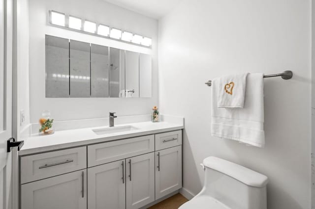 bathroom with vanity and toilet