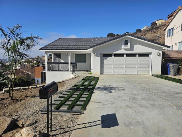 view of front of home with covered porch and a garage