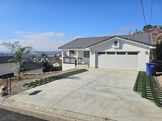 single story home with a garage and a porch