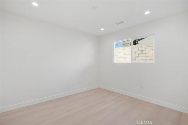 unfurnished room featuring light wood-type flooring