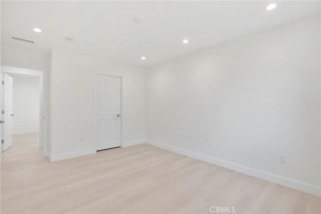 spare room with light wood-type flooring