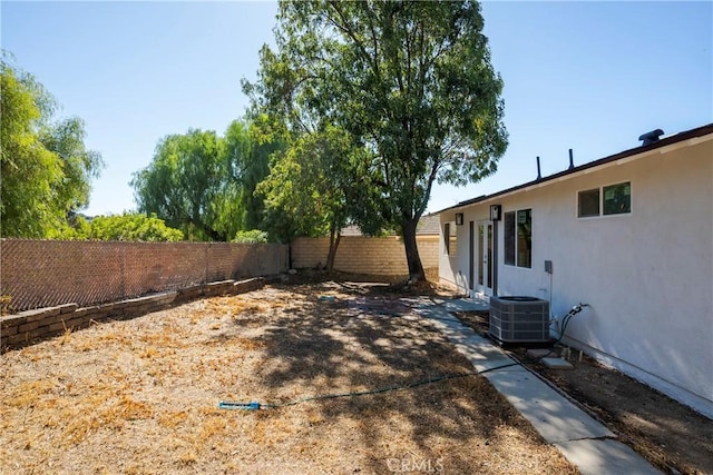 view of yard featuring central AC unit