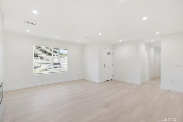 unfurnished room with light hardwood / wood-style floors