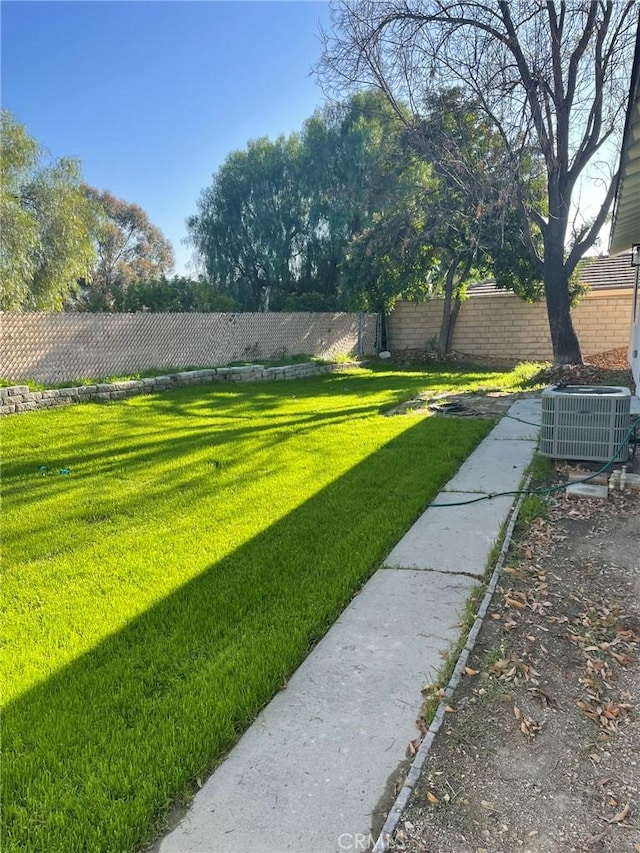 view of yard with central AC