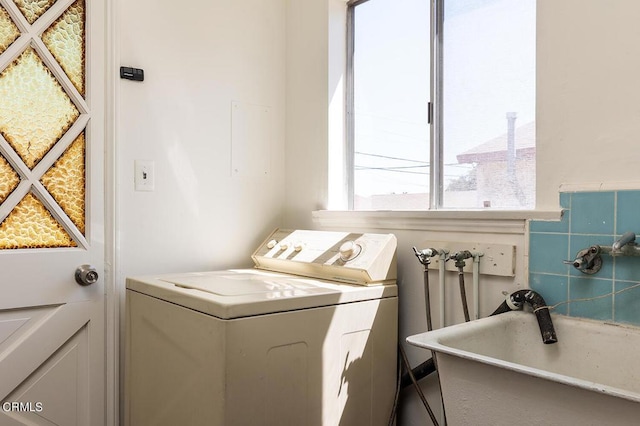 laundry room featuring washer hookup and sink