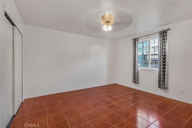 unfurnished bedroom featuring a closet and ceiling fan