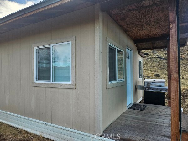 view of side of property with a deck