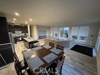 dining area with light hardwood / wood-style flooring