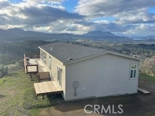 view of side of property featuring a mountain view