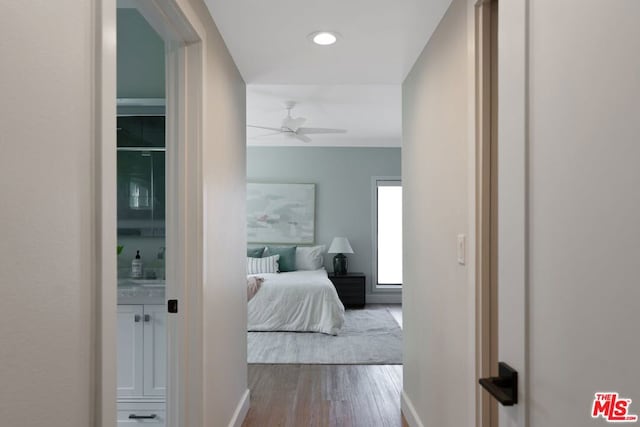 bedroom featuring hardwood / wood-style flooring and ceiling fan