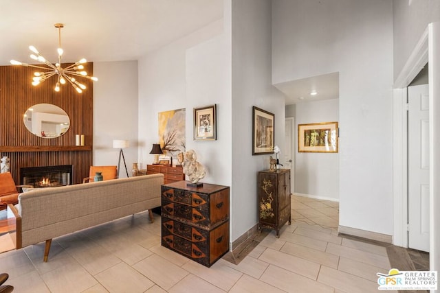 interior space featuring a high ceiling and an inviting chandelier