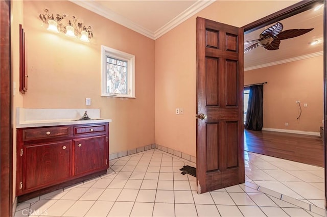 bathroom with vanity, hardwood / wood-style flooring, ceiling fan, and ornamental molding