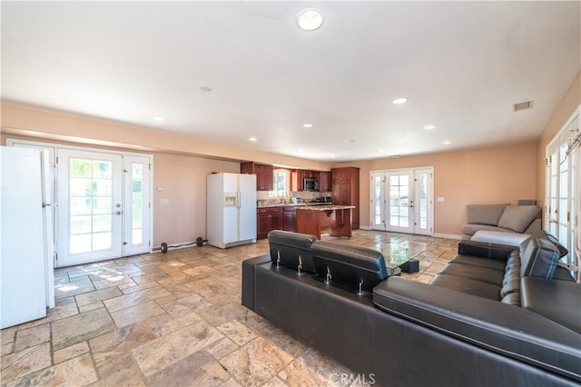 living room with french doors and plenty of natural light