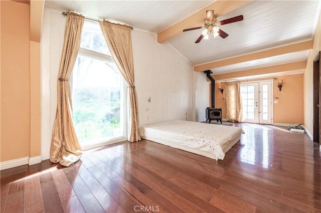 unfurnished bedroom with access to exterior, ceiling fan, french doors, vaulted ceiling with beams, and dark hardwood / wood-style floors