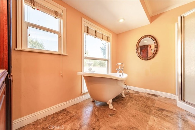 bathroom featuring a washtub