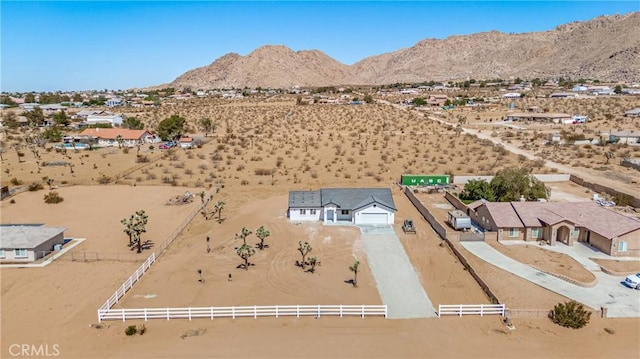 birds eye view of property with a mountain view