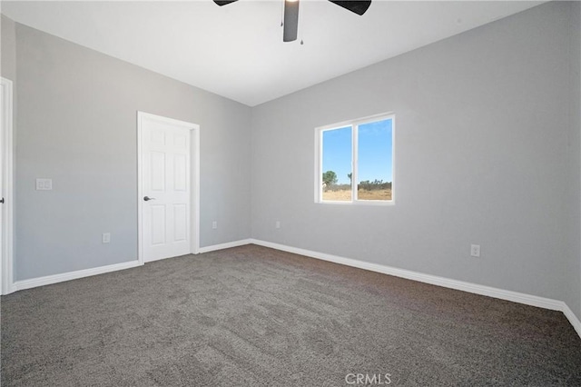 unfurnished room featuring ceiling fan and carpet floors