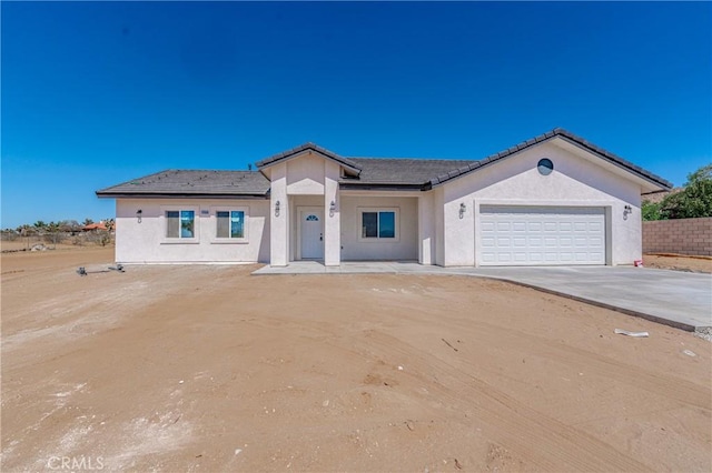 view of front of property with a garage