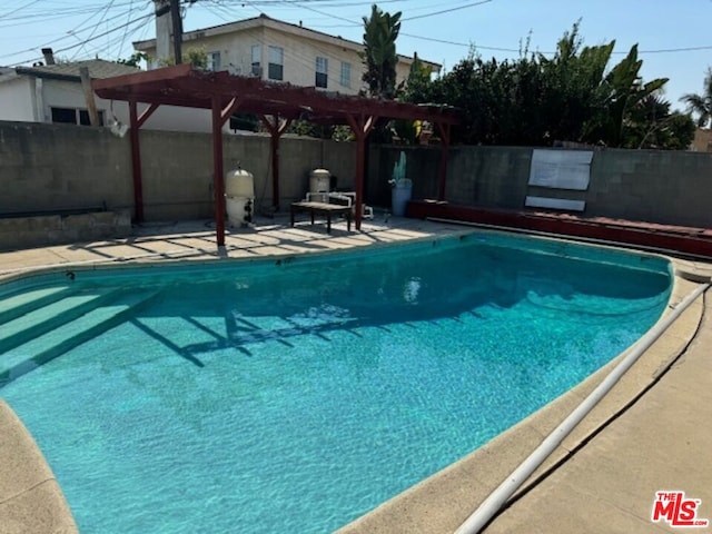 view of pool featuring a pergola and a patio