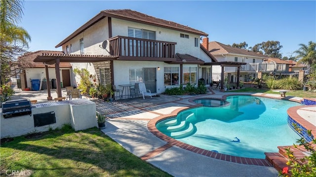 back of house featuring a fenced in pool, a pergola, a balcony, a yard, and a patio