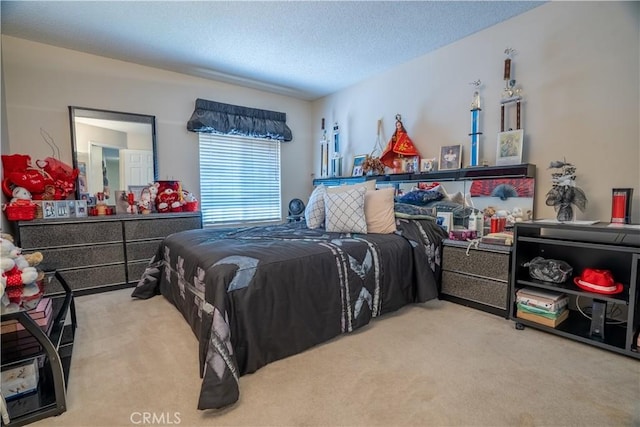 bedroom with carpet floors and a textured ceiling