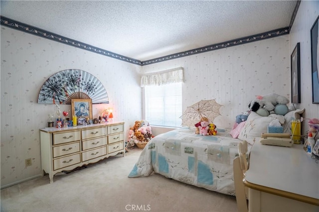 bedroom featuring light carpet and a textured ceiling