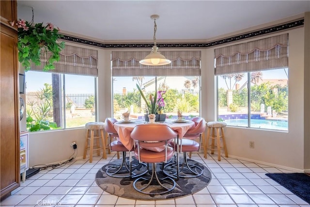 tiled dining space featuring a wealth of natural light