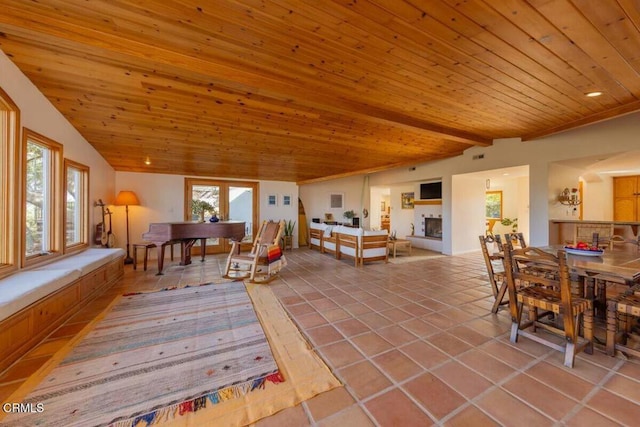 interior space with lofted ceiling with beams, tile patterned floors, and wood ceiling