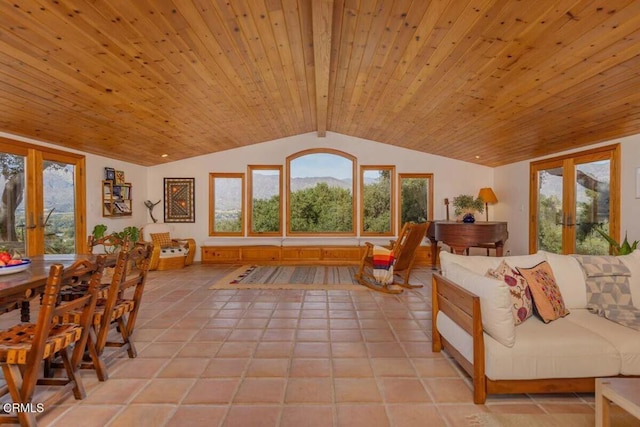 sunroom featuring vaulted ceiling with beams, french doors, and a healthy amount of sunlight