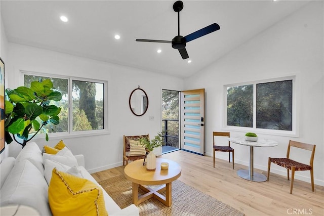 sitting room featuring light wood-type flooring, ceiling fan, and lofted ceiling