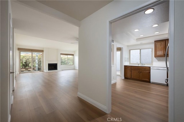 hall featuring hardwood / wood-style floors and a textured ceiling