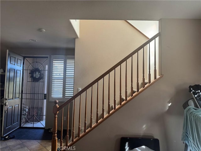 foyer entrance featuring light tile patterned flooring