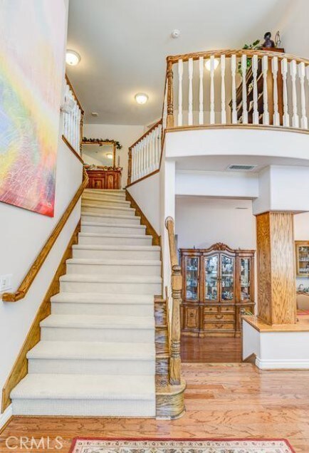 2034 Virazon Dr, La Habra Heights, CA 90631 - stairway with wood finished floors and baseboards
