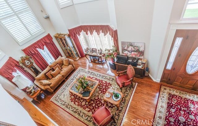 2034 Virazon Dr, La Habra Heights, CA 90631 - living area featuring a towering ceiling and wood finished floors