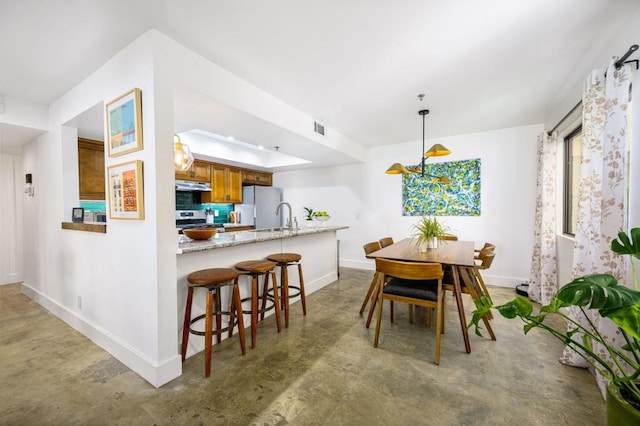 dining room featuring sink