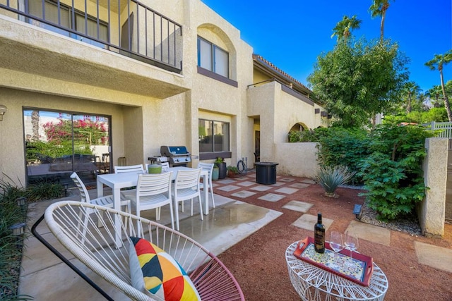 view of patio with a balcony