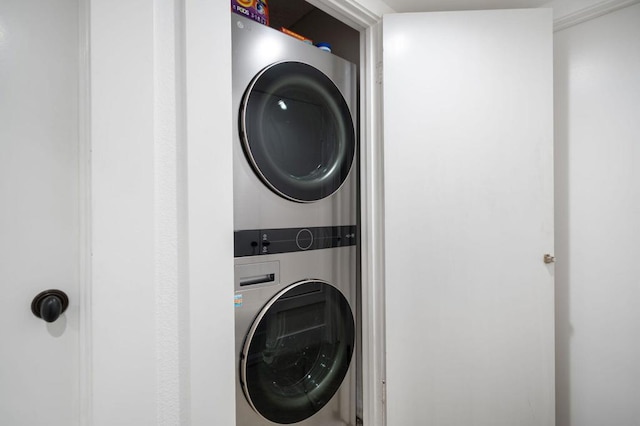 laundry room featuring stacked washer and dryer