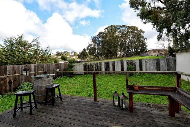 wooden terrace with a yard